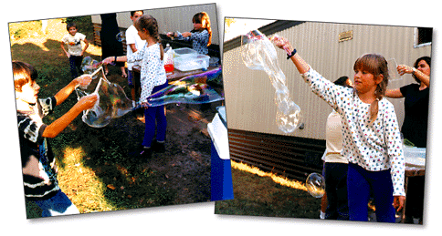 Kids playing with bubbles (55k)