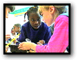 Two girls observing larvae (20k)